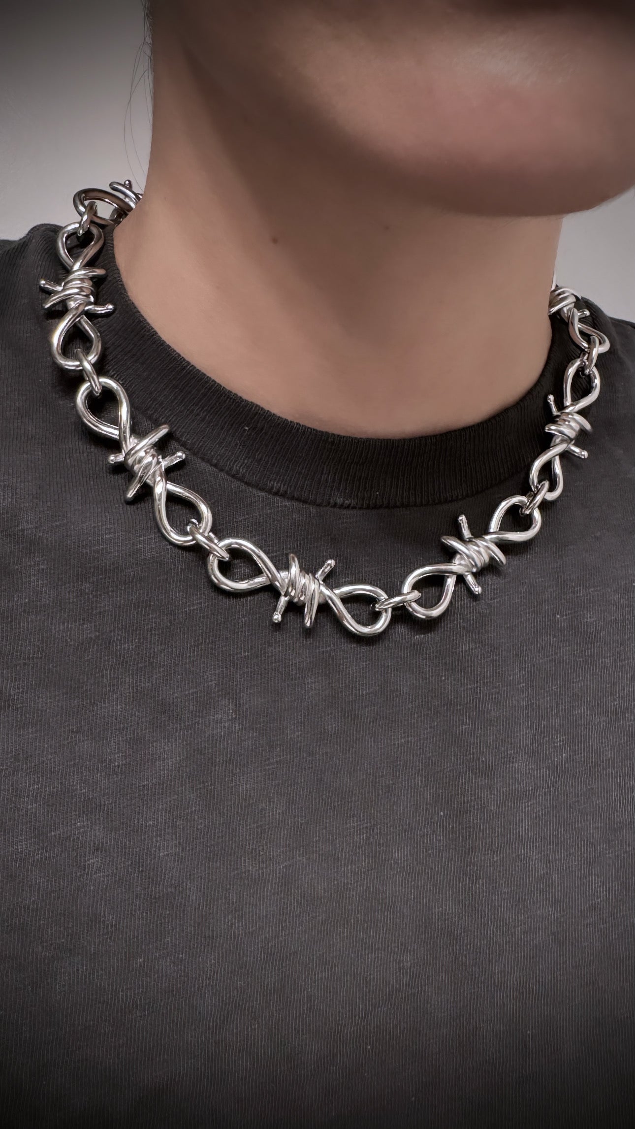 Try on picture of silver punk goth style barbed wire necklace 